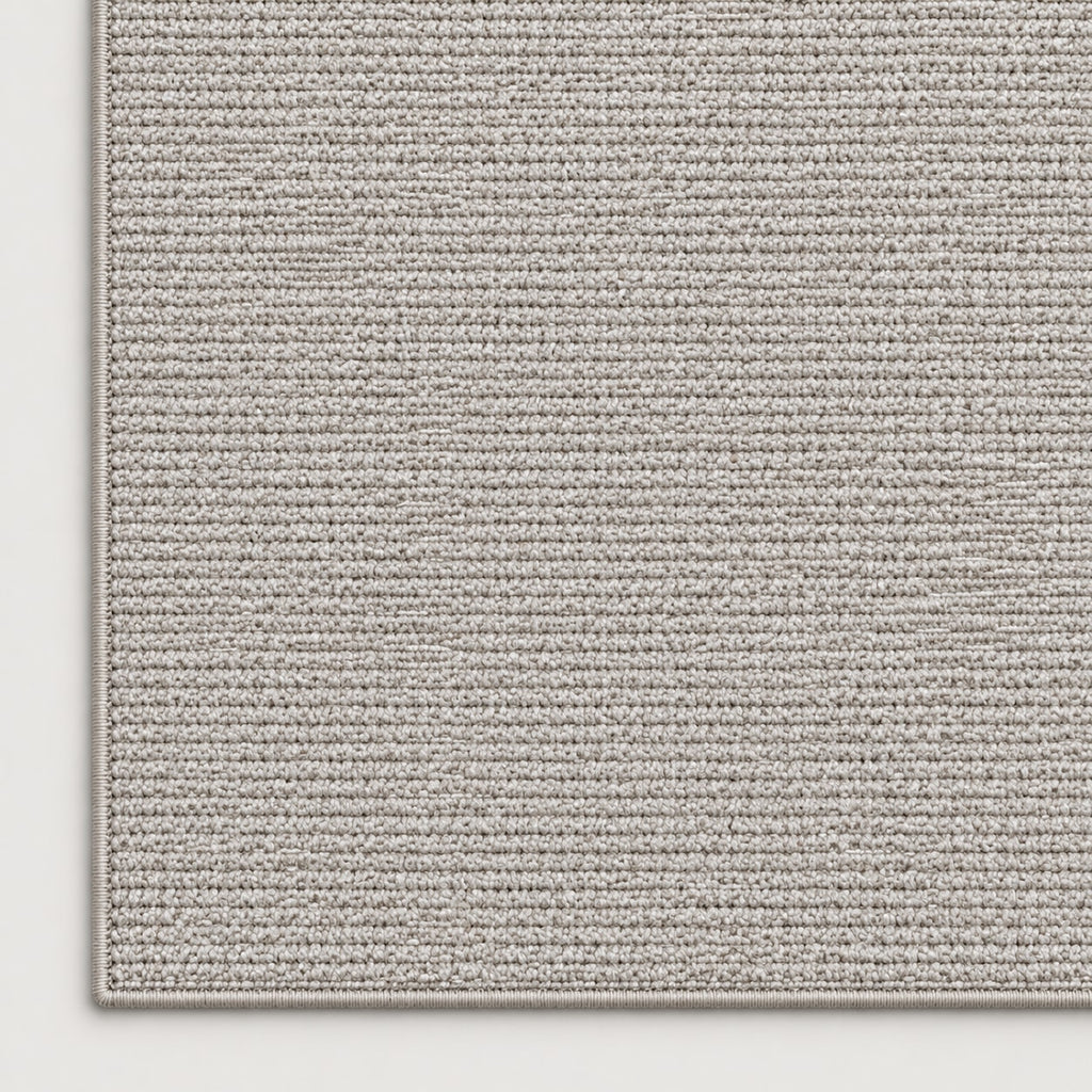 Tapis Alpage gris — coin et texture sur fond clair