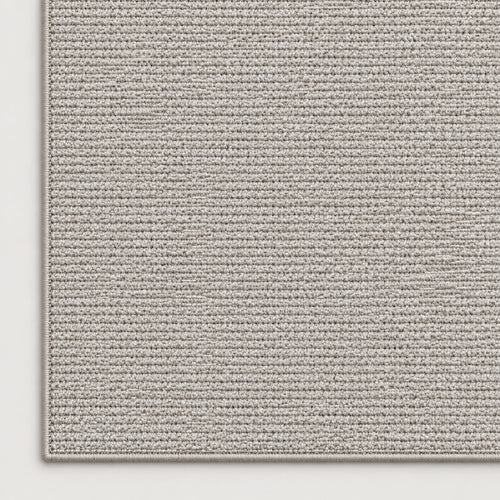 Tapis Alpage gris — coin et texture sur fond clair