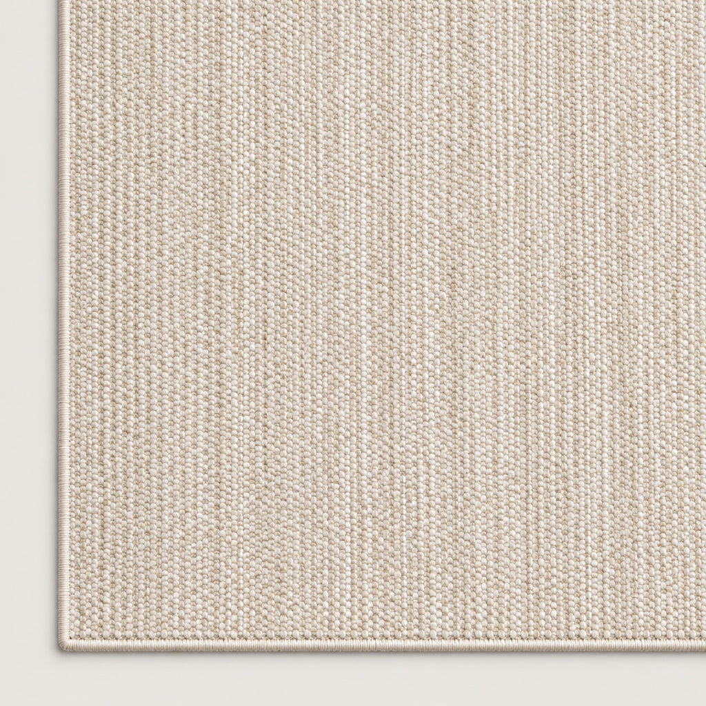 Tapis Dune ivoire — coin et texture sur fond clair
