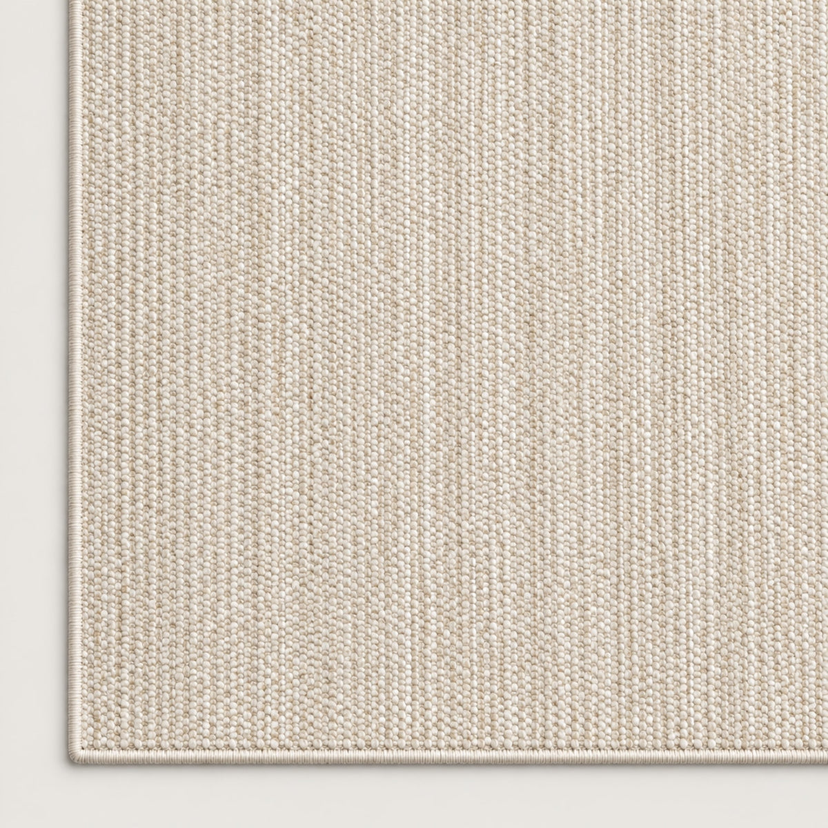 Tapis Dune ivoire — coin et texture sur fond clair