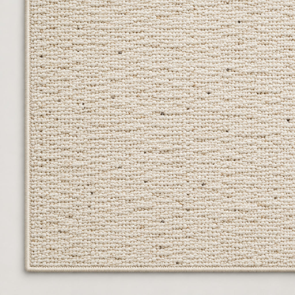 Tapis Grès écru chiné — coin et texture sur fond clair