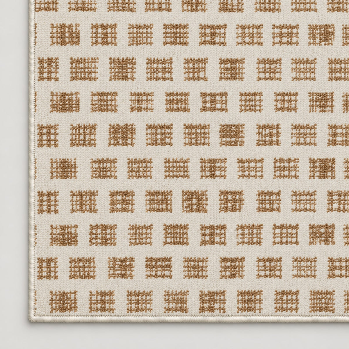 Tapis Mistral ivoire et camel — coin et texture sur fond clair