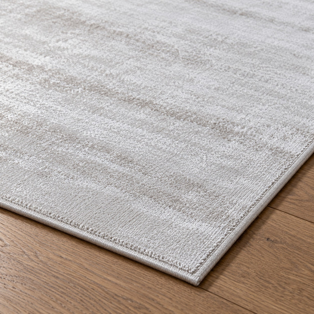 Tapis Opale blanc argenté — détail de la bordure et de l'épaisseur