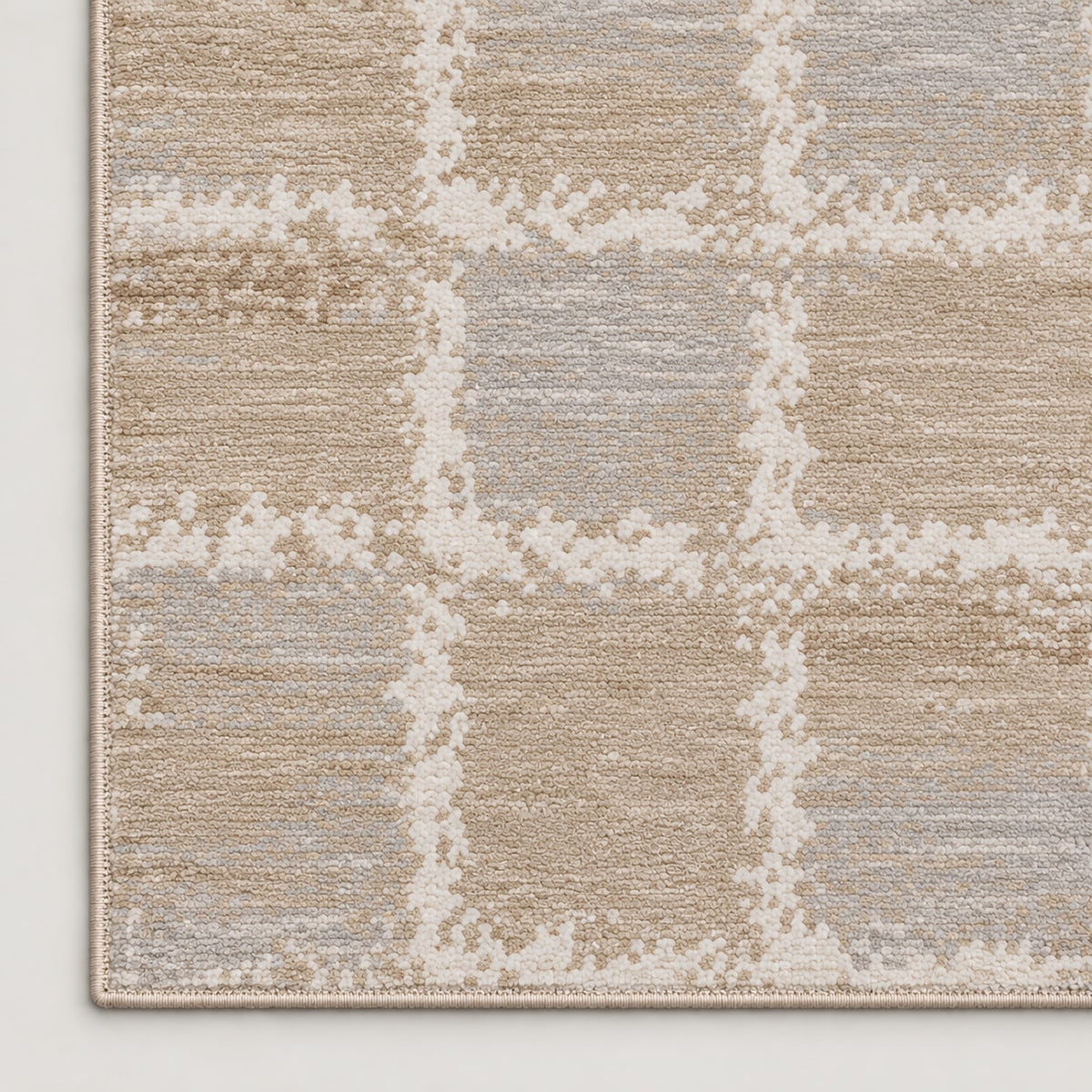 Tapis Rivage grège et bleu — coin et texture sur fond clair